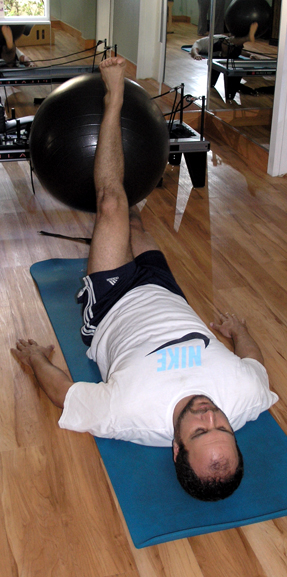 Cardio workout using leg lifts and a ball